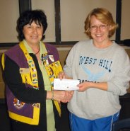 President Terry Fontana presents cheque to Michele Hull for pee wee baseball